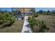 Backyard patio with sun shade structure, ideal for relaxation and entertainment at 14382 Lillian Cir, Port Charlotte, FL 33981