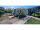 Backyard shed near paved walkway and well maintained garden at 14382 Lillian Cir, Port Charlotte, FL 33981