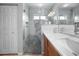 Bathroom featuring modern decor, a glass-enclosed shower, and new cabinetry at 14382 Lillian Cir, Port Charlotte, FL 33981