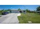 Charming single-story home with well-manicured lawn, driveway and a two-car garage at 14382 Lillian Cir, Port Charlotte, FL 33981