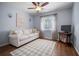 Cozy living room with wood floors, a comfortable sofa, and lots of natural light, perfect for relaxing at 14382 Lillian Cir, Port Charlotte, FL 33981