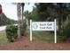 Entrance to South Gulf Cove Park, showcasing lush landscaping and a welcoming community space at 14382 Lillian Cir, Port Charlotte, FL 33981