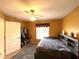 Bedroom with a ceiling fan, large window, and built-in shelves and bed at 14399 Morristown Ave, Port Charlotte, FL 33981