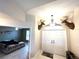 Welcoming entryway with double doors, unique deer head decor, and a view into the bedroom at 14399 Morristown Ave, Port Charlotte, FL 33981