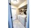 Functional laundry room with a side by side washer and dryer and ample storage space above at 14399 Morristown Ave, Port Charlotte, FL 33981