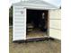 Outbuilding with open doors and wood floors; perfect for storage at 14399 Morristown Ave, Port Charlotte, FL 33981
