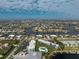 Aerial view of a residential neighborhood featuring multiple canals and some condo buildings at 1461 Aqui Esta Dr # B3, Punta Gorda, FL 33950