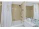 Cozy bathroom featuring a shower and tub and a decorative shower curtain at 1461 Aqui Esta Dr # B3, Punta Gorda, FL 33950