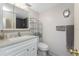 Bathroom with vanity, mirror, and tile shower at 1461 Aqui Esta Dr # B3, Punta Gorda, FL 33950