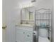 Bathroom with vanity, mirror, and storage rack at 1461 Aqui Esta Dr # B3, Punta Gorda, FL 33950