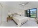 Bright bedroom featuring a large window overlooking the yard and neutral decor at 1461 Aqui Esta Dr # B3, Punta Gorda, FL 33950