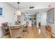 Open-concept dining area with view to kitchen and front door at 1461 Aqui Esta Dr # B3, Punta Gorda, FL 33950