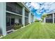 Exterior view of the property showcasing a well-manicured lawn and inviting outdoor living spaces at 1461 Aqui Esta Dr # B3, Punta Gorda, FL 33950