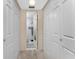 Hallway with multiple closet and bathroom entrance at 1461 Aqui Esta Dr # B3, Punta Gorda, FL 33950
