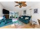 Comfortable living room featuring a ceiling fan and view to the backyard at 1461 Aqui Esta Dr # B3, Punta Gorda, FL 33950