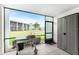 Screened-in patio featuring grill and storage cabinet with community view at 1461 Aqui Esta Dr # B3, Punta Gorda, FL 33950