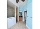 Bathroom with tiled flooring and a glass-enclosed shower, with an individual sink and storage at 14970 Appleton Blvd, Port Charlotte, FL 33981