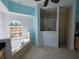 Bright bathroom features a soaking tub under an arched window and a glass-enclosed shower at 14970 Appleton Blvd, Port Charlotte, FL 33981
