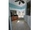 Bright bathroom featuring a soaking tub under two windows with a dark vanity at 14970 Appleton Blvd, Port Charlotte, FL 33981