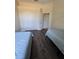 Bedroom with two twin beds and dark floors and light walls at 14970 Appleton Blvd, Port Charlotte, FL 33981