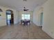 Spacious dining room with tile floors and views of the canal at 14970 Appleton Blvd, Port Charlotte, FL 33981