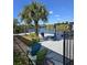 Exterior featuring a waterfront home with a private dock, seating, and canal views at 14970 Appleton Blvd, Port Charlotte, FL 33981