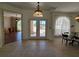 Spacious foyer with tile flooring, arched doorways, and natural light at 14970 Appleton Blvd, Port Charlotte, FL 33981