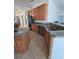 Kitchen features stainless steel appliances, granite countertops, and a double sink at 14970 Appleton Blvd, Port Charlotte, FL 33981