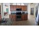 Bright kitchen features granite countertops, stainless steel appliances, and ample cabinet space at 14970 Appleton Blvd, Port Charlotte, FL 33981