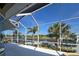 Enclosed lanai features waterfront views and a screened enclosure at 14970 Appleton Blvd, Port Charlotte, FL 33981