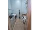 Laundry room features new washer and dryer and shelving and utility sink at 14970 Appleton Blvd, Port Charlotte, FL 33981