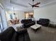 Open concept living room with a ceiling fan and tile flooring at 14970 Appleton Blvd, Port Charlotte, FL 33981