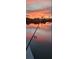 Fishing pole with a beautiful sunset sky over the water at 14970 Appleton Blvd, Port Charlotte, FL 33981