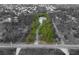 Unique property surrounded by natural landscape in this black-and-white toned aerial view at 150 N Oxford Dr, Englewood, FL 34223