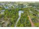 Enjoy the privacy of a home nestled in a lush, green canopy with waterway access in a quiet neighborhood at 150 N Oxford Dr, Englewood, FL 34223