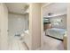 Bright bathroom with a tub and tiled floors, conveniently located next to the bedroom at 150 N Oxford Dr, Englewood, FL 34223