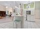 Kitchen with breakfast bar island open to the living and dining areas at 150 N Oxford Dr, Englewood, FL 34223