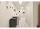 Bright laundry room featuring a sink, storage, and modern appliances for convenient home management at 150 N Oxford Dr, Englewood, FL 34223