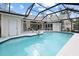 Inviting screened pool with a large deck perfect for outdoor living and entertaining at 150 N Oxford Dr, Englewood, FL 34223