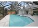 Enjoy the lovely screened pool with a spacious deck and outdoor entertainment space at 150 N Oxford Dr, Englewood, FL 34223