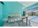 Well-equipped outdoor kitchen with a built-in grill and a bar, perfect for entertaining at 15652 Ruston Cir, Port Charlotte, FL 33981