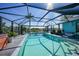 Sparkling pool with screened enclosure offering privacy and views of the beautiful canal at 15652 Ruston Cir, Port Charlotte, FL 33981