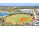 Manicured baseball field ready for play, featuring well-maintained grass and clay at 16273 Coconut Palm Dr, Port Charlotte, FL 33953