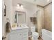 Well-lit bathroom with a tub and shower combo, tiled floors, and a modern sink and vanity at 16273 Coconut Palm Dr, Port Charlotte, FL 33953