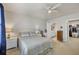 This bedroom features a connecting bathroom with a double sink vanity, tiled floors, and walk in closet at 16273 Coconut Palm Dr, Port Charlotte, FL 33953
