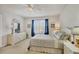 This beautiful bedroom features a large window, stylish curtains, and neutral paint, creating a peaceful retreat at 16273 Coconut Palm Dr, Port Charlotte, FL 33953
