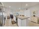 Open kitchen with stainless steel appliances, granite countertops, and large kitchen island at 16273 Coconut Palm Dr, Port Charlotte, FL 33953