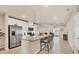 Modern kitchen with stainless steel appliances, granite countertops, and island with seating at 16273 Coconut Palm Dr, Port Charlotte, FL 33953