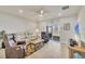 Bright and spacious living room featuring neutral tones and a view to the lake at 16273 Coconut Palm Dr, Port Charlotte, FL 33953