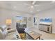 Spacious living room with view to the lake, modern furnishings, and tile floors at 16273 Coconut Palm Dr, Port Charlotte, FL 33953